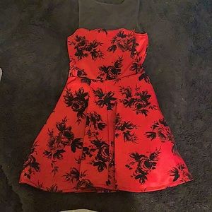 A beautiful red dress with black roses